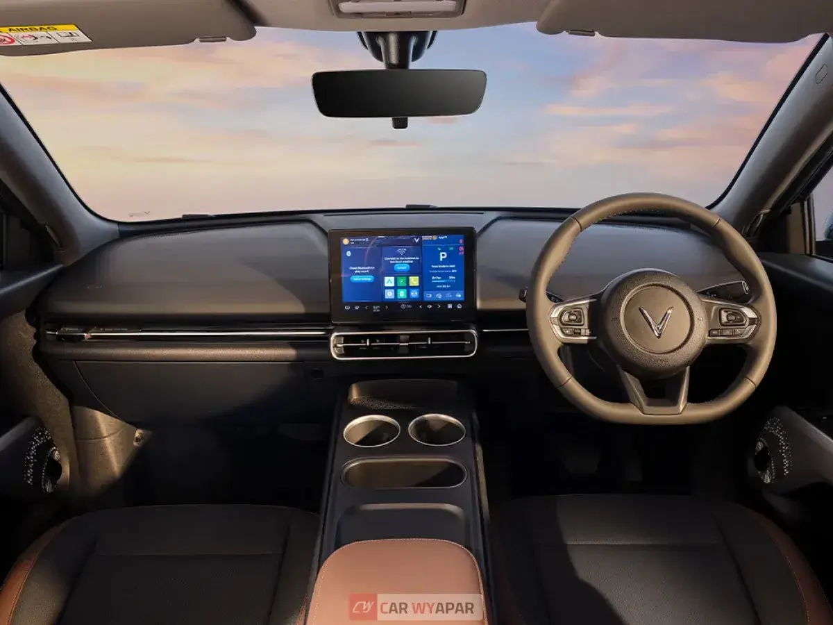 Interior view of a modern car dashboard featuring a large digital touchscreen display. Vinfast MPV7